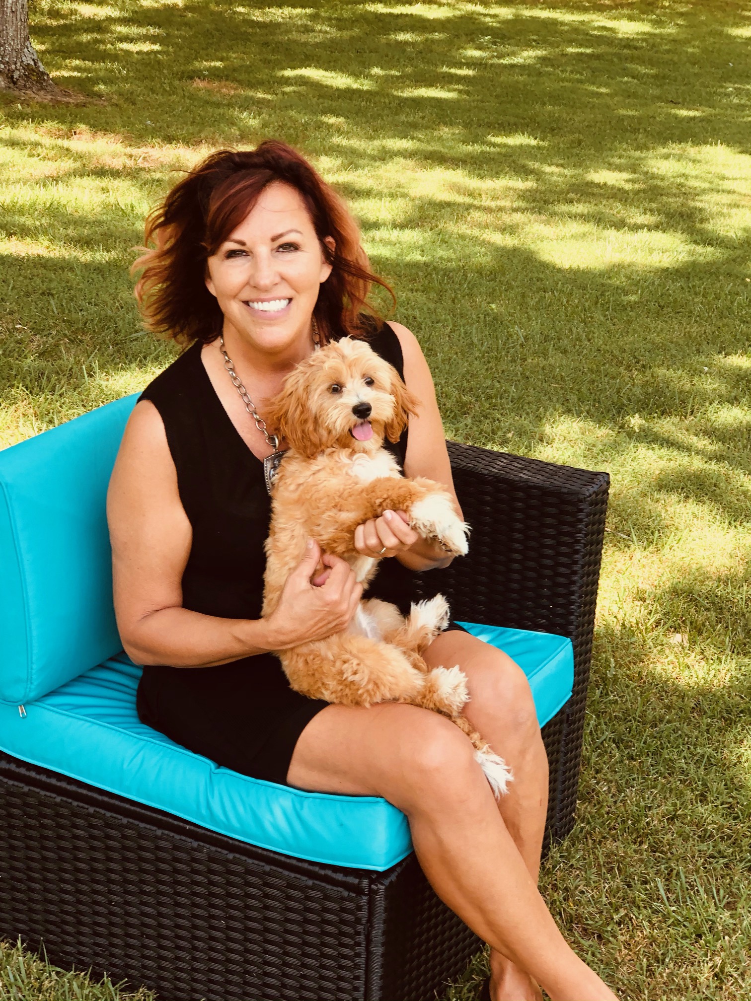 Image is of Jan with a LhasaPoo Family Teddy Bear. 